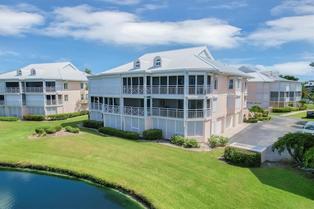 view of property featuring a garage and driveway