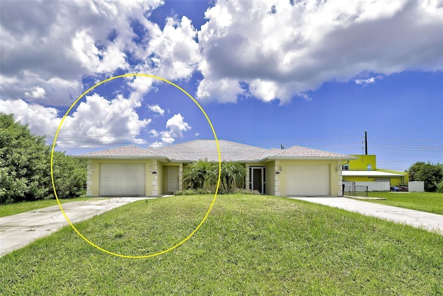 ranch-style house featuring a garage and a front lawn