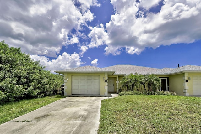 ranch-style house featuring a garage and a front lawn