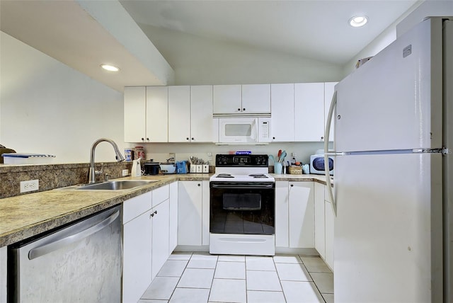 kitchen featuring white appliances, light tile patterned floors, white cabinets, vaulted ceiling, and sink