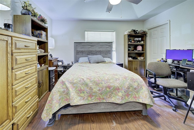 bedroom featuring hardwood / wood-style floors and ceiling fan