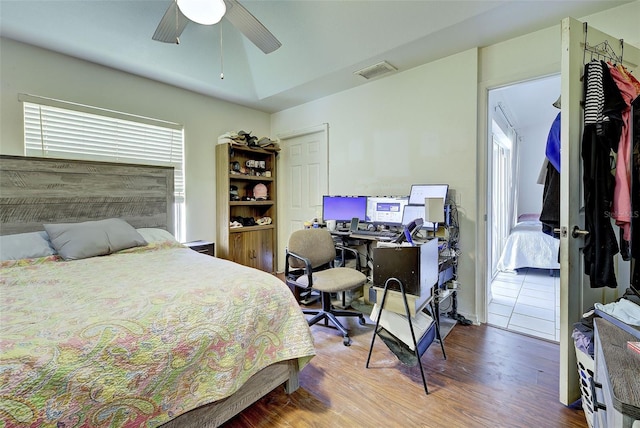 bedroom featuring hardwood / wood-style flooring and ceiling fan