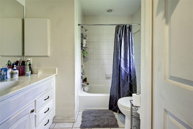 full bathroom with vanity, tile patterned floors, shower / tub combo, and toilet