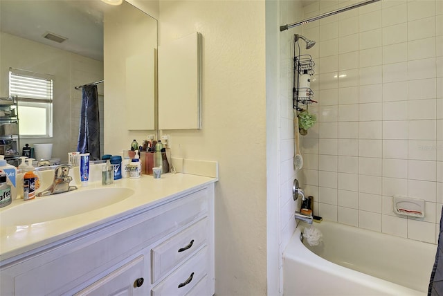 bathroom featuring shower / bath combination with curtain and vanity