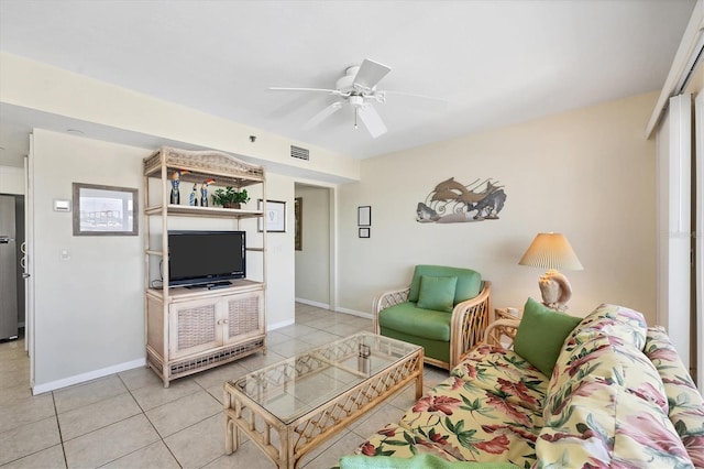 tiled living room featuring ceiling fan