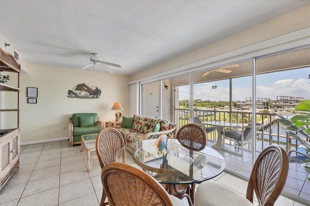 tiled dining room featuring ceiling fan