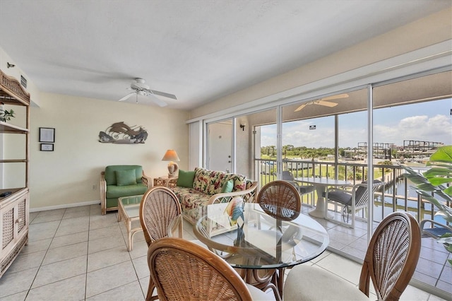 7070 Placida Rd Unit 1221, Placida, FL 33946 - dining space featuring a ceiling fan, light tile patterned floors, and baseboards