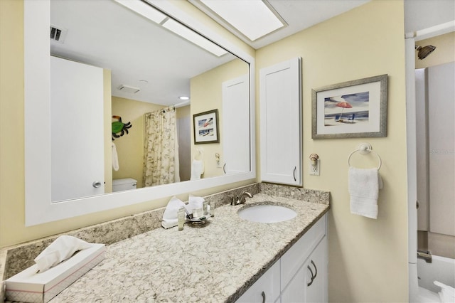 7070 Placida Rd Unit 1221, Placida, FL 33946 - bathroom featuring vanity, toilet, and a shower with curtain