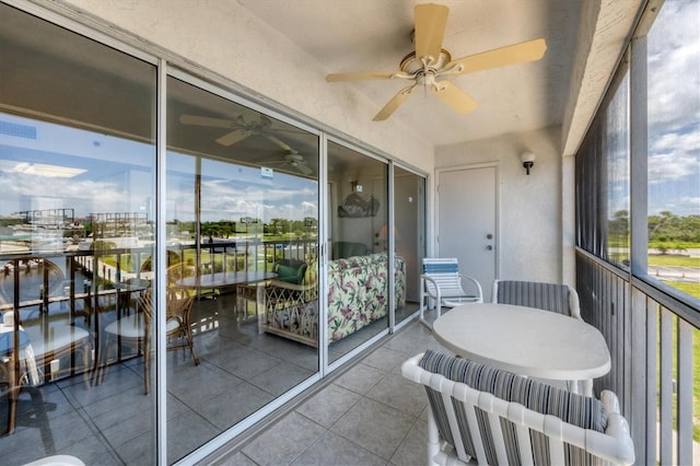 balcony featuring ceiling fan