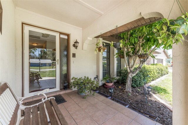 property entrance featuring stucco siding