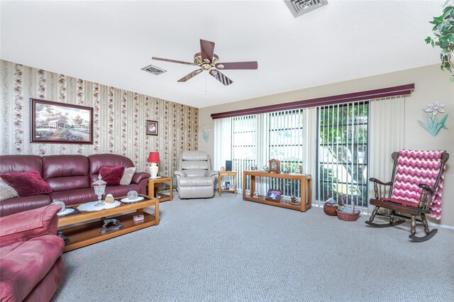 carpeted living room featuring ceiling fan