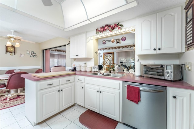 kitchen with kitchen peninsula, white cabinets, dishwasher, and ceiling fan