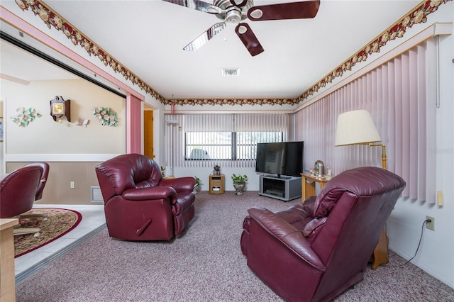 living room featuring carpet and ceiling fan