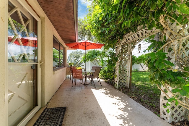 view of patio featuring outdoor dining space