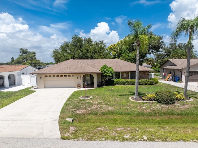 single story home featuring a garage, concrete driveway, a gate, stucco siding, and a front lawn