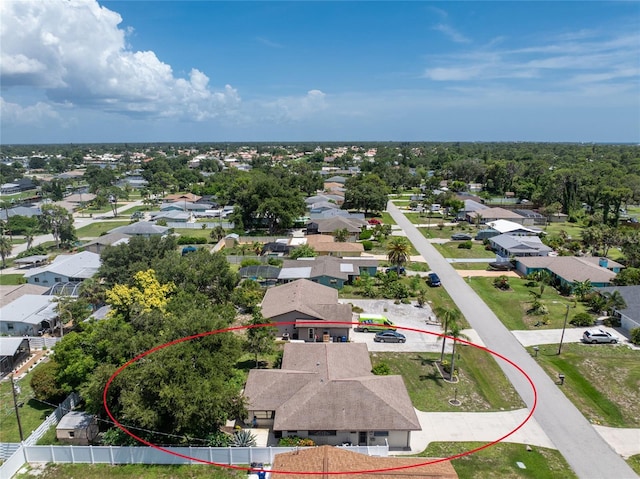 birds eye view of property with a residential view