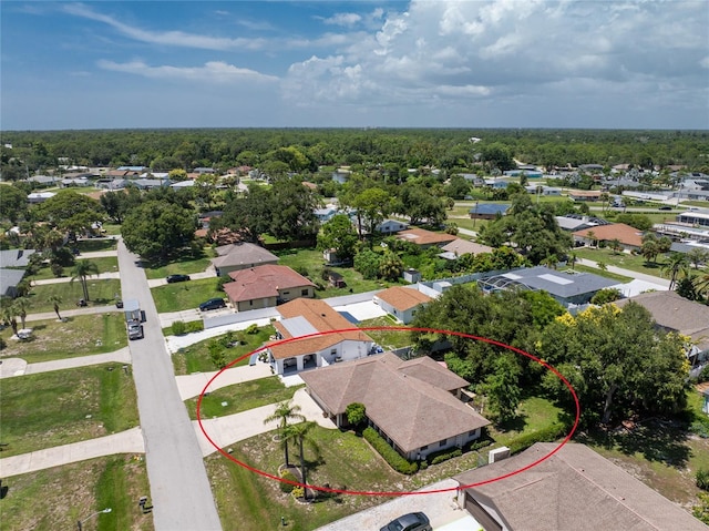 birds eye view of property with a residential view