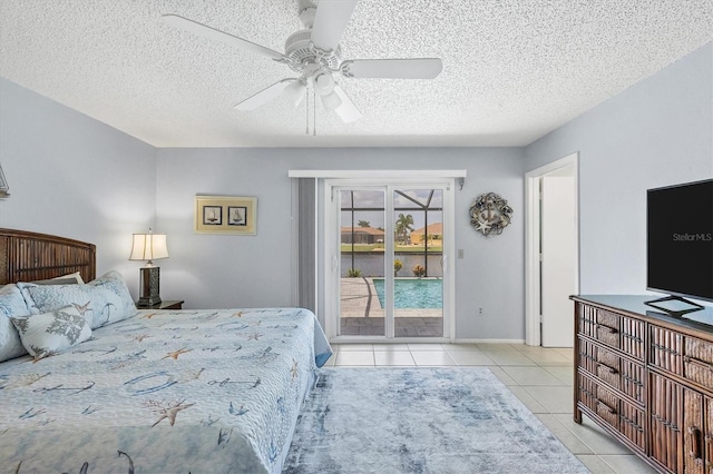 tiled bedroom with access to outside, a textured ceiling, and ceiling fan