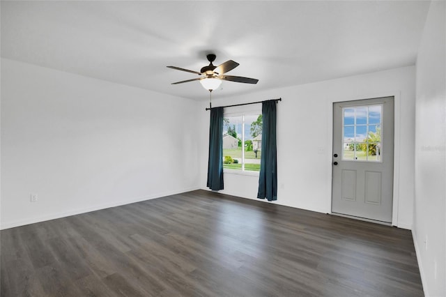 unfurnished room featuring dark hardwood / wood-style flooring and ceiling fan