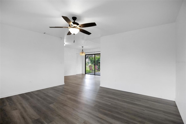 unfurnished room with dark hardwood / wood-style floors and ceiling fan