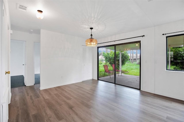 empty room featuring wood-type flooring