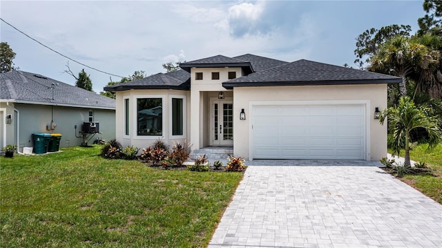 view of front facade featuring a garage and a front lawn