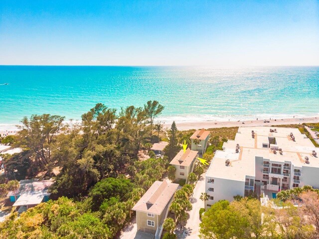 bird's eye view featuring a water view and a view of the beach