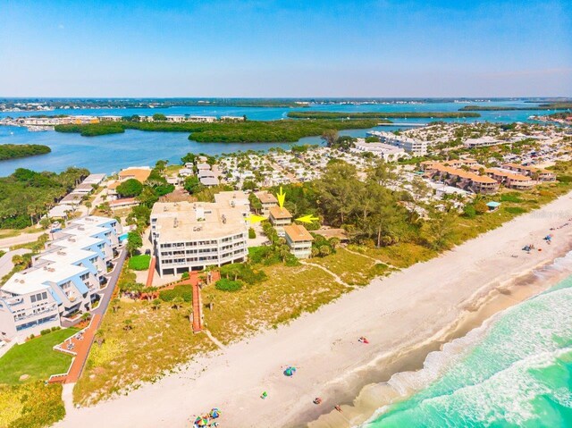 bird's eye view with a water view and a view of the beach