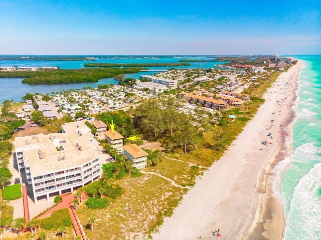 bird's eye view with a beach view and a water view