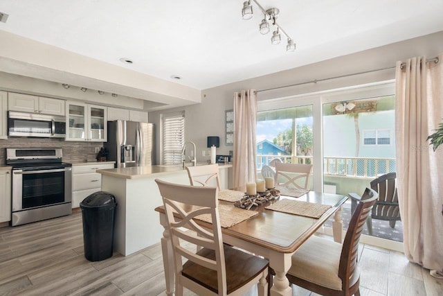 dining area with light wood-type flooring