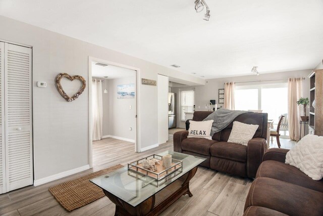 living room featuring light wood-type flooring