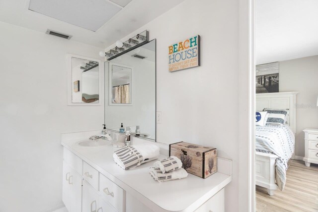 bathroom featuring vanity and wood-type flooring