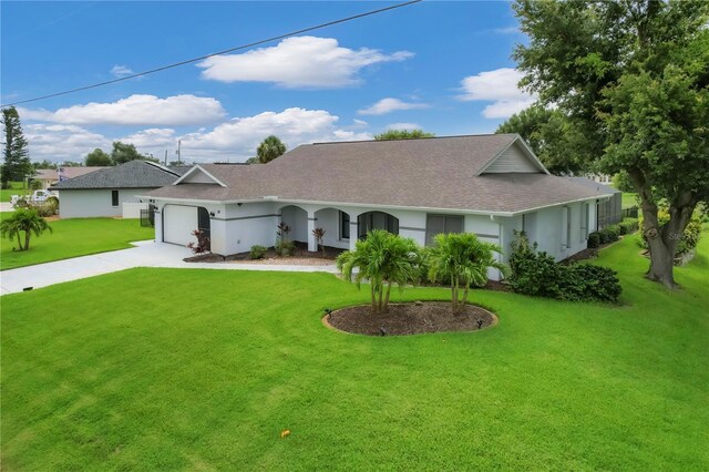 single story home featuring a garage and a front yard