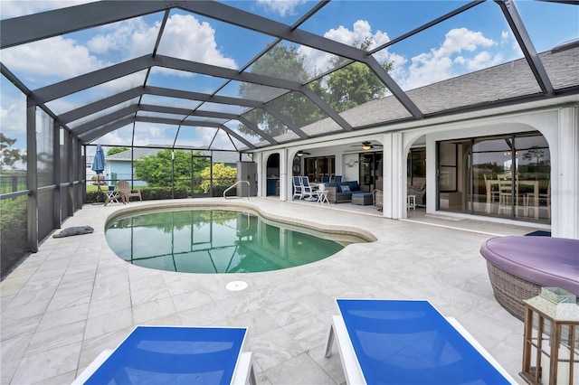 view of pool featuring ceiling fan, an outdoor hangout area, a patio area, and a lanai