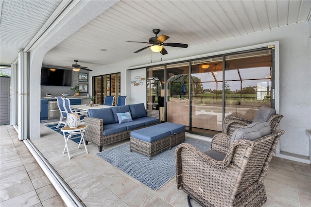 view of patio featuring ceiling fan, an outdoor hangout area, and a lanai