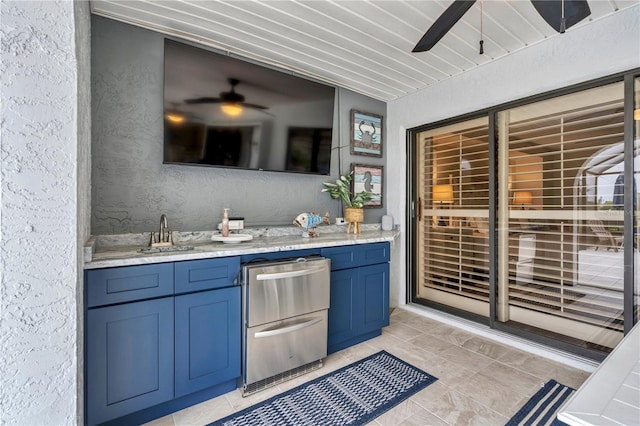 interior space with sink and ceiling fan