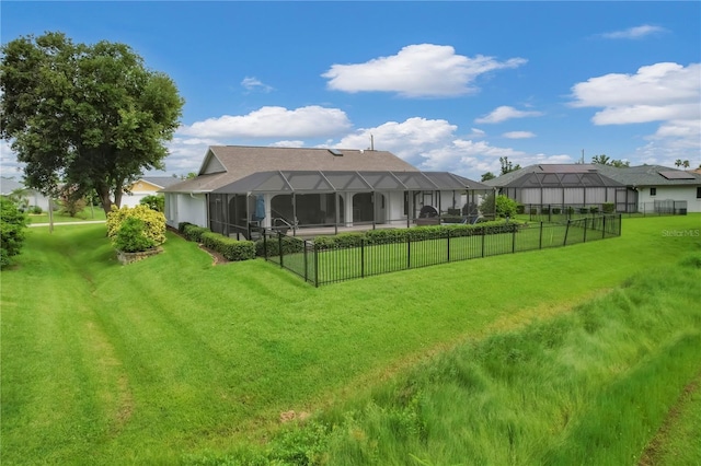 back of house with a lanai and a lawn