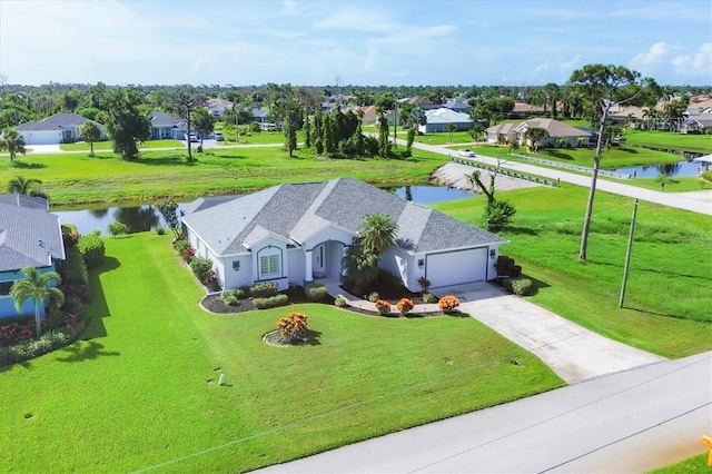 bird's eye view with a residential view and a water view