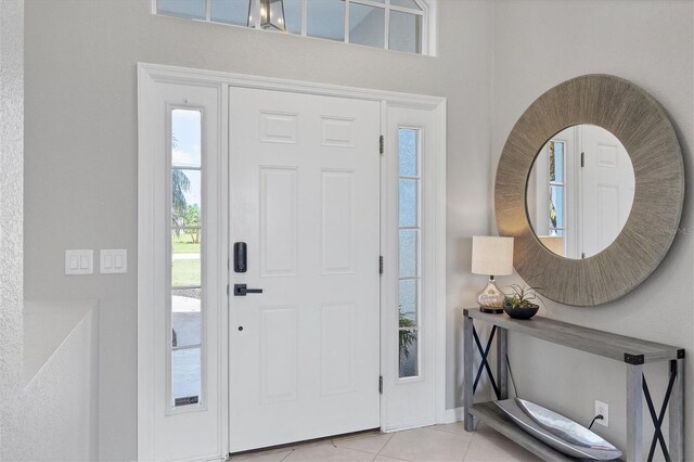 entrance foyer featuring light tile patterned flooring