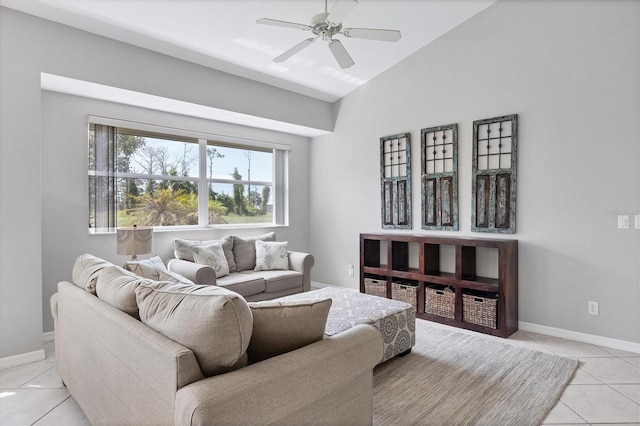 tiled living room with ceiling fan and lofted ceiling