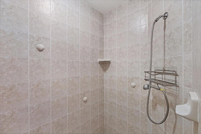 bathroom with a tile shower