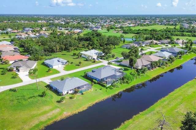 bird's eye view featuring a water view and a residential view