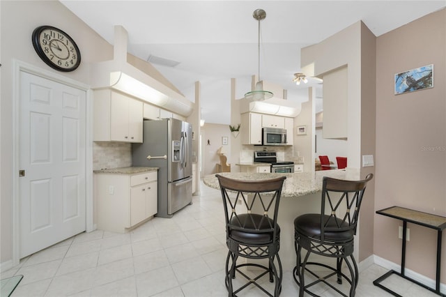 kitchen with white cabinetry, kitchen peninsula, stainless steel appliances, and light tile patterned floors