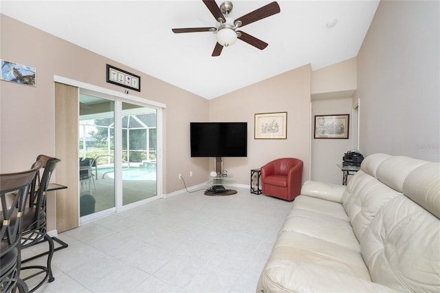 tiled living room with ceiling fan and lofted ceiling