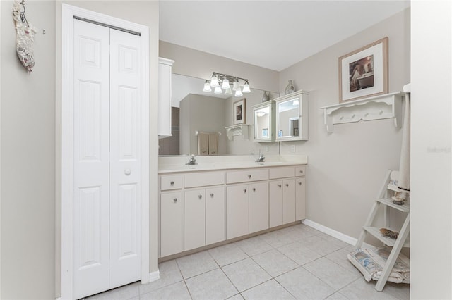 bathroom with tile patterned flooring and double sink vanity