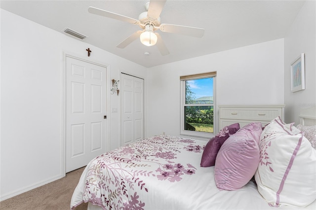 bedroom with carpet, a closet, and ceiling fan