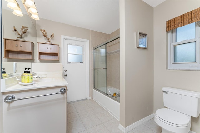 full bathroom with tile patterned floors, shower / bath combination with glass door, toilet, and vanity