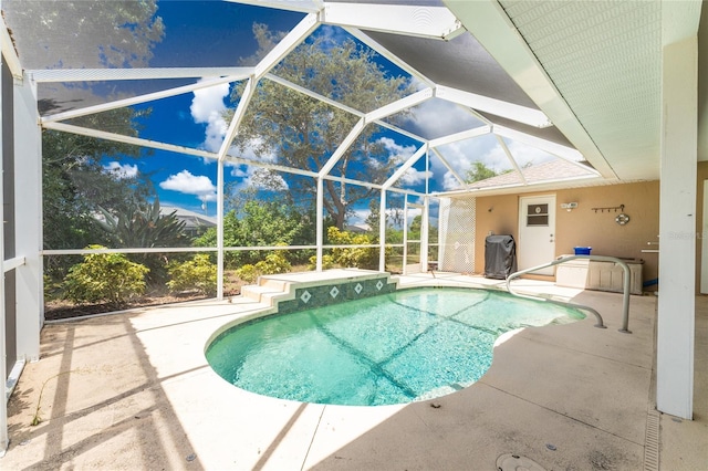 view of pool featuring a lanai and a patio