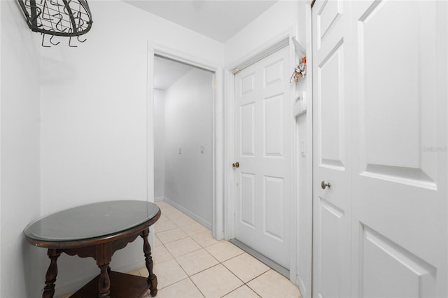 hallway featuring light tile patterned floors