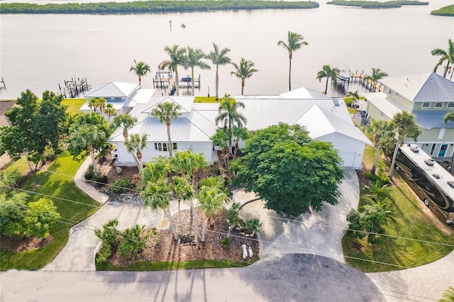 drone / aerial view with a water view and a residential view